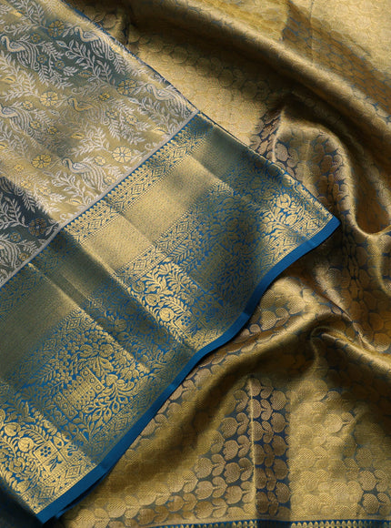 Pure kanchipuram tissue silk saree dual shade of pista green and peacock green with alllover zari woven peacock brocade weaves and rich zari woven border