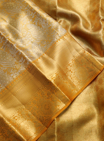 Pure kanchipuram tissue silk saree dark mustard with allover zari woven brocade weaves and rich zari woven border