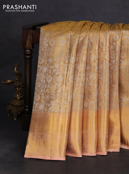 Pure kanchipuram tissue silk saree gold and pastel peach with allover zari woven brocade weaves and rich zari woven border