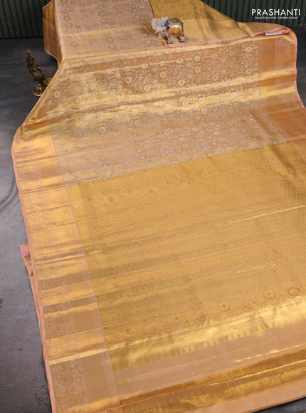 Pure kanchipuram tissue silk saree gold and pastel peach with allover zari woven brocade weaves and rich zari woven border