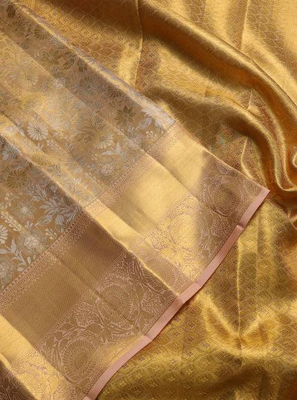 Pure kanchipuram tissue silk saree gold and pastel peach with allover zari woven brocade weaves and rich zari woven border