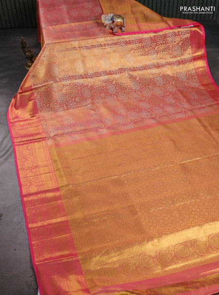 Pure kanchipuram tissue silk saree dual shade of golden peach and peach pink with allover zari woven floral brocade weaves and rich zari woven border