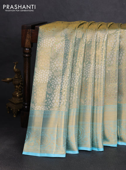 Pure kanchipuram tissue silk saree golden light blue and light blue with allover zari woven floral brocade weaves and rich zari woven border