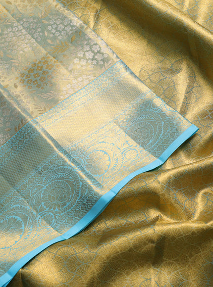 Pure kanchipuram tissue silk saree golden light blue and light blue with allover zari woven floral brocade weaves and rich zari woven border