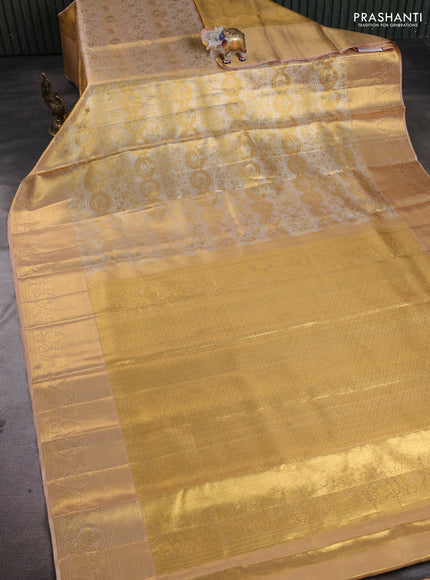 Pure kanchipuram tissue silk saree gold and sandal with allover zari woven brocade weaves and rich zari woven border