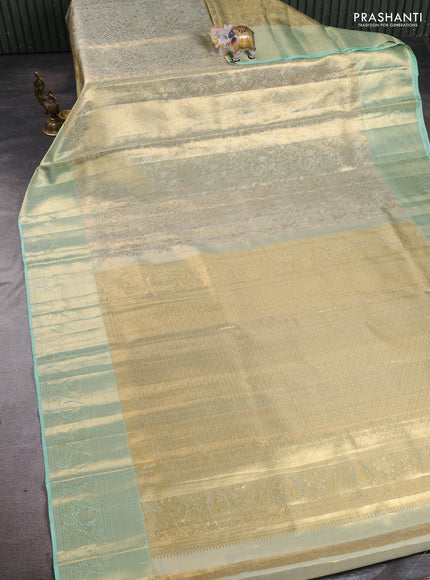 Pure kanchipuram tissue silk saree dual shade of pista green with allover zari woven floral brocade weaves and rich zari woven border