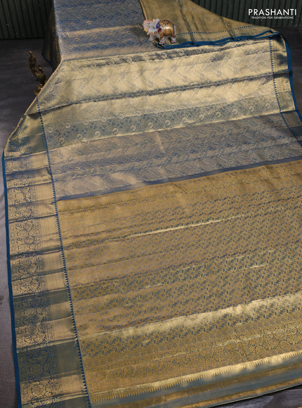 Pure kanchipuram tissue silk saree dual shade of peacock blue with allover zari woven brocade weaves and rich zari woven border