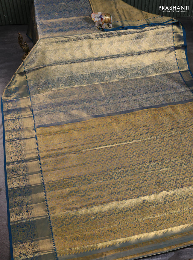 Pure kanchipuram tissue silk saree dual shade of peacock blue with allover zari woven brocade weaves and rich zari woven border