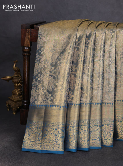 Pure kanchipuram tissue silk saree dual shade of gold and peacock blue with allover zari woven brocade peacock weaves and rich zari woven border