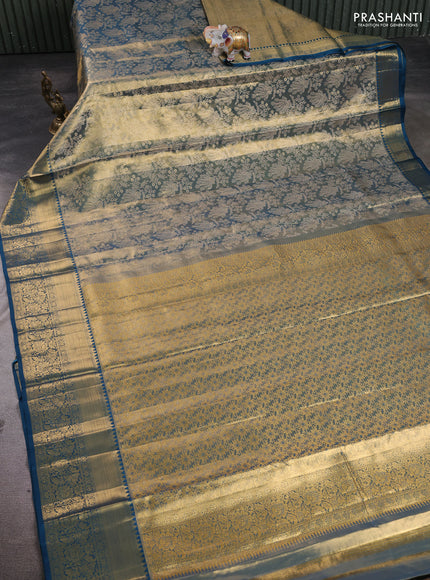 Pure kanchipuram tissue silk saree dual shade of gold and peacock blue with allover zari woven brocade peacock weaves and rich zari woven border