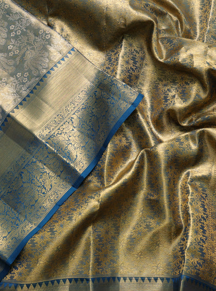 Pure kanchipuram tissue silk saree dual shade of gold and peacock blue with allover zari woven brocade peacock weaves and rich zari woven border