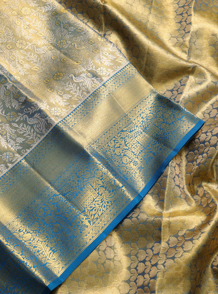 Pure kanchipuram tissue silk saree gold and peacock green with allover zari woven brocade peacock weaves and rich zari woven border