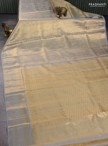 Pure kanchipuram tissue silk saree gold and grey with allover zari woven brocade floral weaves and rich zari woven border