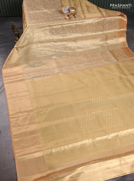 Pure kanchipuram tissue silk saree sandal with allover zari woven brocade weaves and rich zari woven border