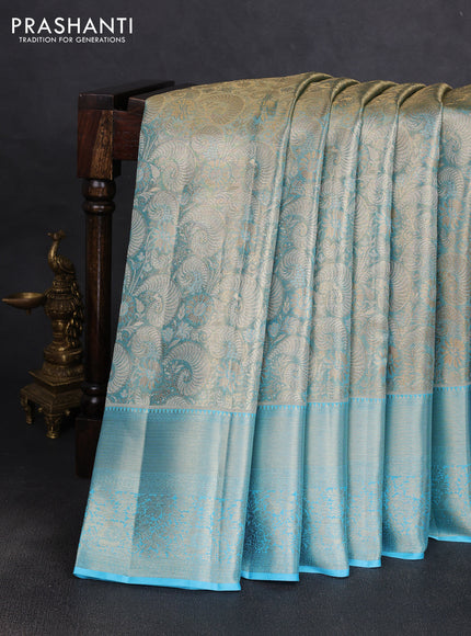 Pure kanchipuram tissue silk saree light blue with allover zari woven brocade weaves and long rich zari woven floral border