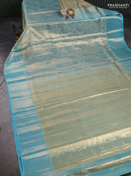 Pure kanchipuram tissue silk saree light blue with allover zari woven brocade weaves and long rich zari woven floral border