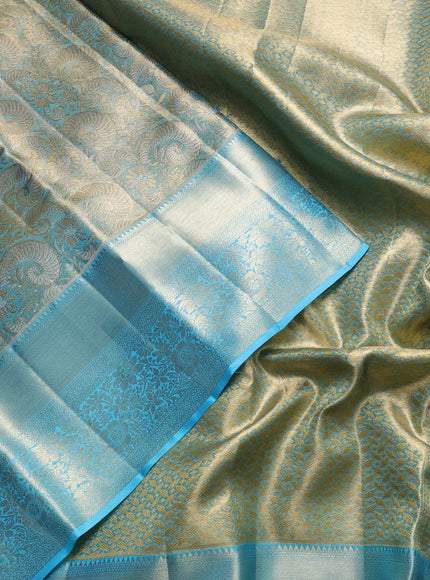 Pure kanchipuram tissue silk saree light blue with allover zari woven brocade weaves and long rich zari woven floral border