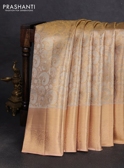 Pure kanchipuram tissue silk saree sandal with allover zari woven brocade weaves and long rich zari woven floral border