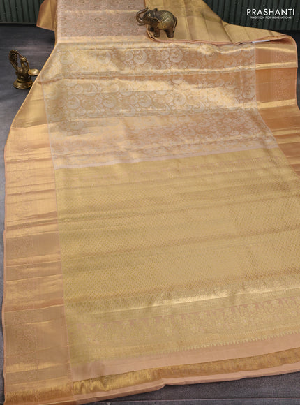 Pure kanchipuram tissue silk saree sandal with allover zari woven brocade weaves and long rich zari woven floral border