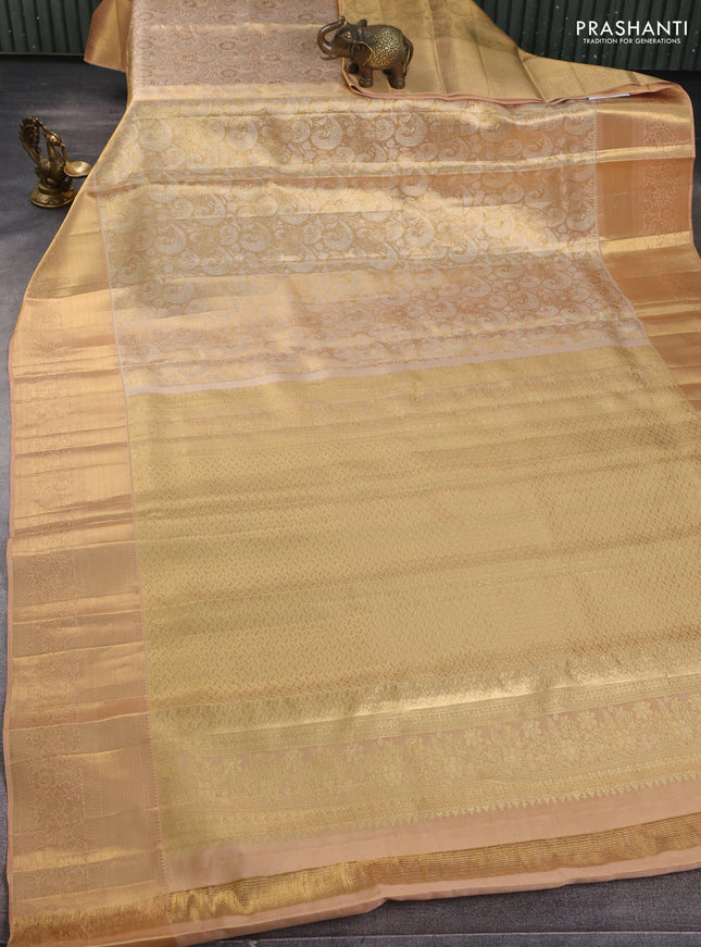Pure kanchipuram tissue silk saree sandal with allover zari woven brocade weaves and long rich zari woven floral border