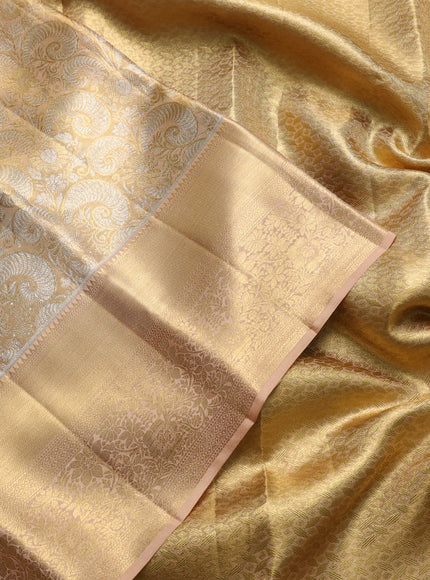 Pure kanchipuram tissue silk saree sandal with allover zari woven brocade weaves and long rich zari woven floral border