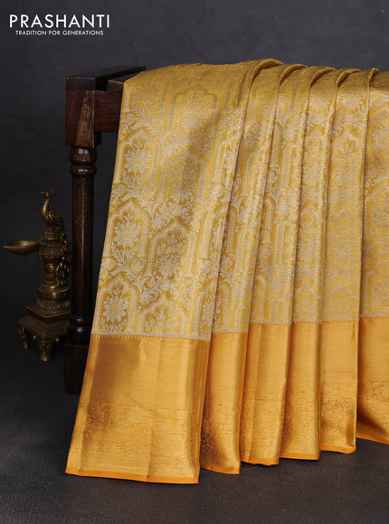 Pure kanchipuram tissue silk saree mustard yellow with allover zari woven brocade weaves and long rich zari woven floral border