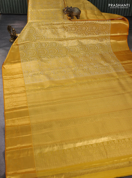 Pure kanchipuram tissue silk saree mustard yellow with allover zari woven brocade weaves and long rich zari woven floral border