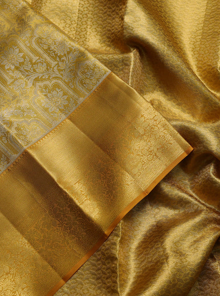 Pure kanchipuram tissue silk saree mustard yellow with allover zari woven brocade weaves and long rich zari woven floral border