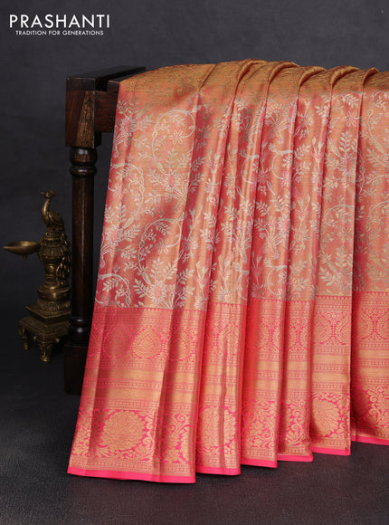 Pure kanchipuram tissue silk saree dual shade of peach and peach pink with allover zari woven brocade weaves and long rich zari woven floral border