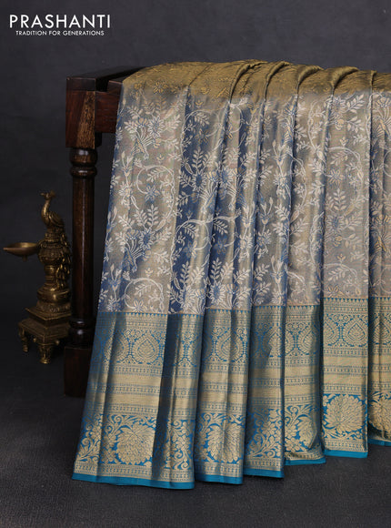 Pure kanchipuram tissue silk saree golen blue and peacock green with allover zari woven brocade weaves and long rich zari woven floral border