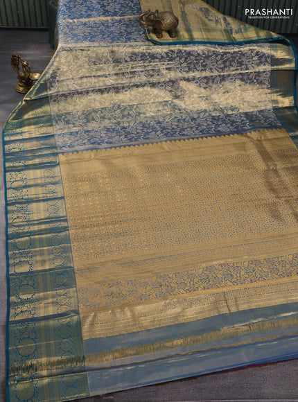 Pure kanchipuram tissue silk saree golen blue and peacock green with allover zari woven brocade weaves and long rich zari woven floral border