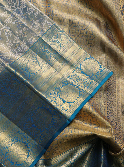 Pure kanchipuram tissue silk saree golen blue and peacock green with allover zari woven brocade weaves and long rich zari woven floral border