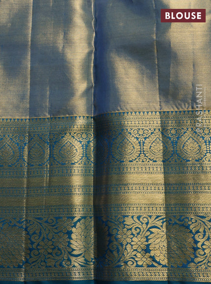 Pure kanchipuram tissue silk saree golen blue and peacock green with allover zari woven brocade weaves and long rich zari woven floral border