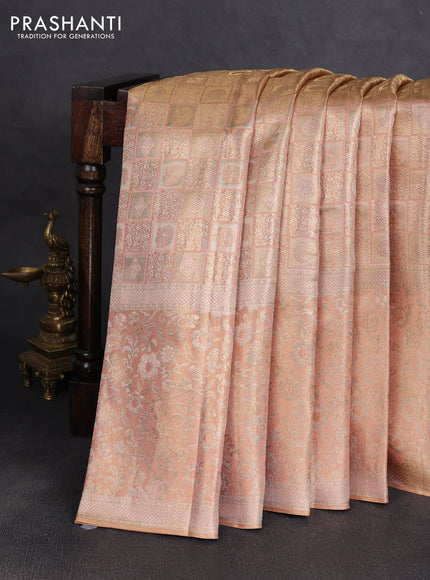 Pure kanchipuram tissue silk saree pastel peach with allover zari woven brocade weaves and long rich zari woven floral border