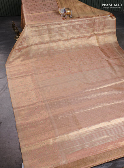 Pure kanchipuram tissue silk saree pastel peach with allover zari woven brocade weaves and long rich zari woven floral border