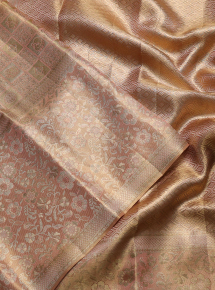Pure kanchipuram tissue silk saree pastel peach with allover zari woven brocade weaves and long rich zari woven floral border