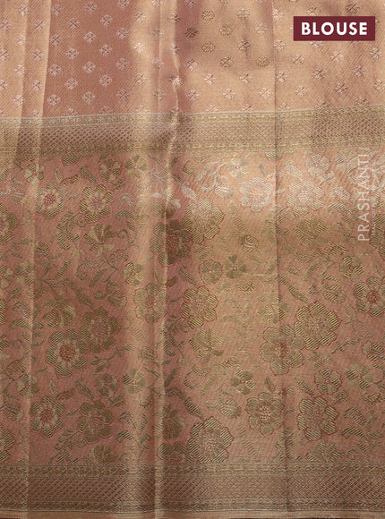 Pure kanchipuram tissue silk saree pastel peach with allover zari woven brocade weaves and long rich zari woven floral border