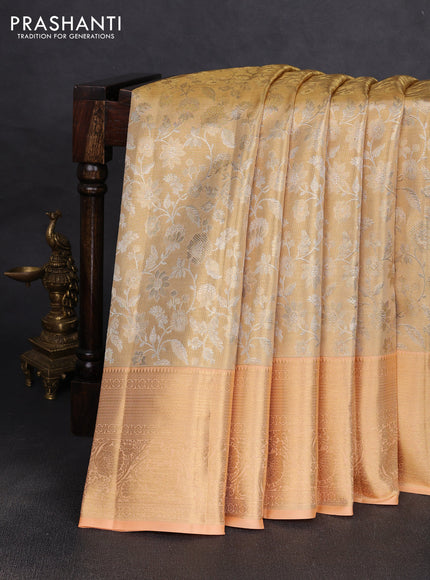 Pure kanchipuram tissue silk saree gold and pale orange with allover zari woven brocade weaves and rich zari woven border