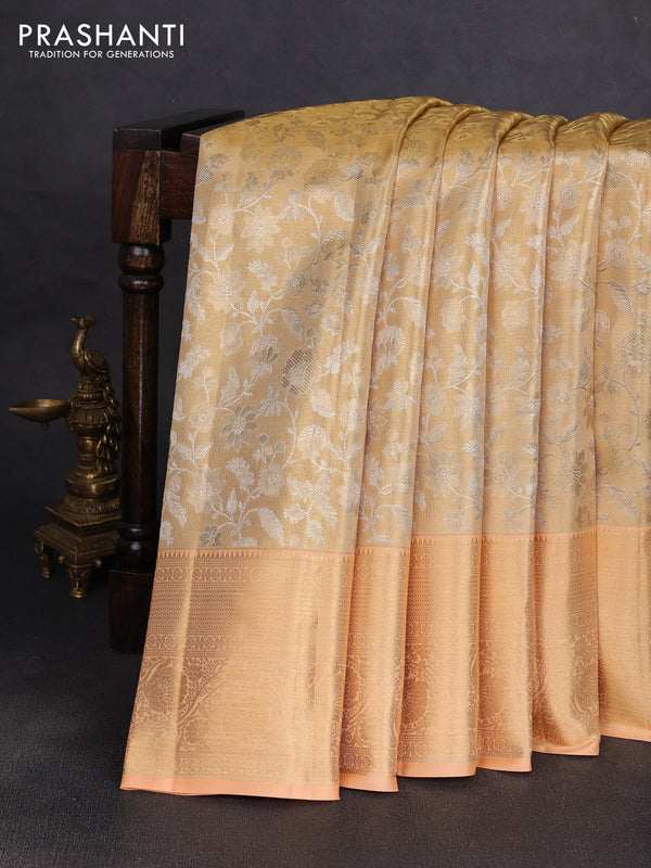 Pure kanchipuram tissue silk saree gold and pale orange with allover zari woven brocade weaves and rich zari woven border