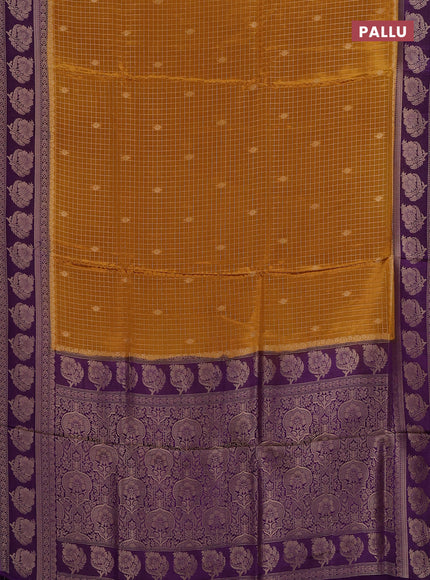 Semi mysore silk saree dark mustard and violet with allover small zari checks & buttas and floral zari woven border
