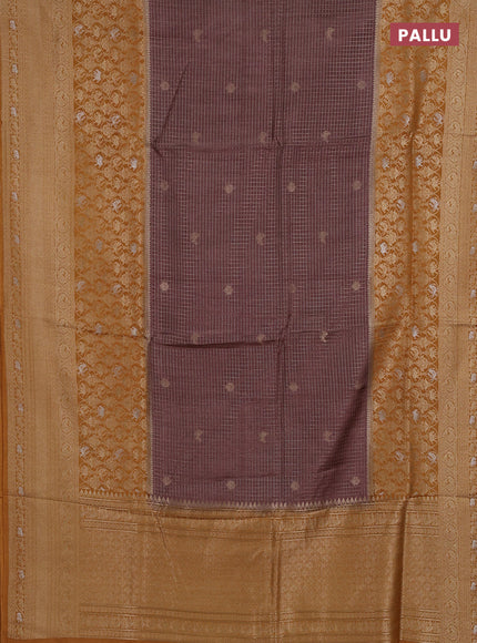 Semi mysore silk saree pastel brown and yellow with allover small zari checks & buttas and long zari woven border