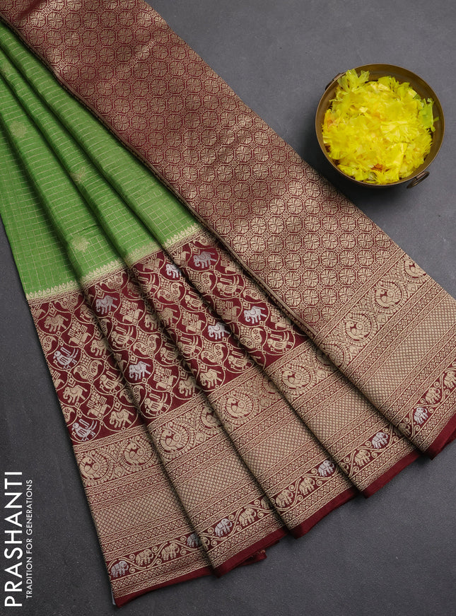 Semi mysore silk saree green and deep maroon with allover small zari checks & buttas and long zari woven border
