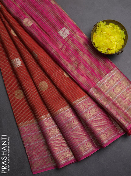 Semi mysore silk saree rustic orange and pink with allover small zari checks & buttas and long zari woven border