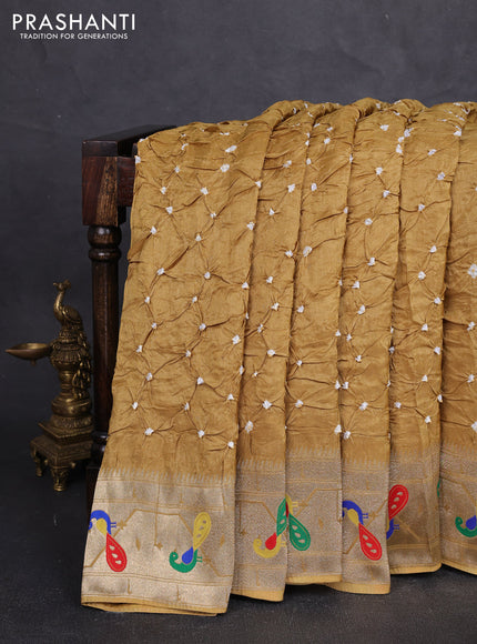 Dola silk saree mustard yellow with allover bandhani prints and paithani border