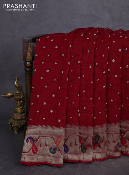 Dola silk saree red with allover bandhani prints and paithani border
