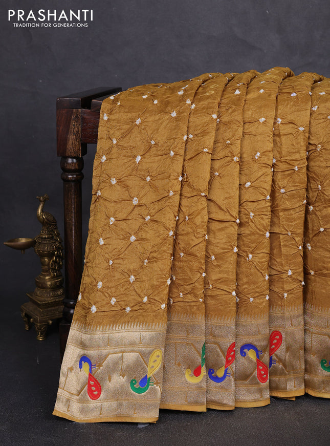 Dola silk saree dark mustard yellow with allover bandhani prints and paithani border