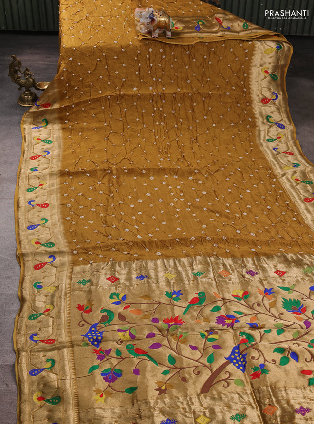 Dola silk saree dark mustard yellow with allover bandhani prints and paithani border
