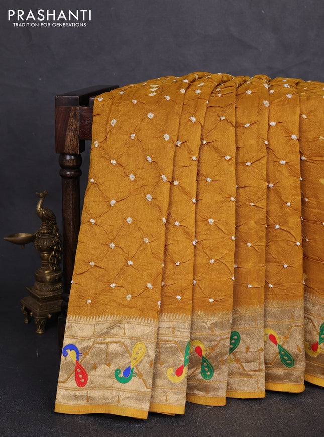 Dola silk saree mustard yellow with allover bandhani prints and paithani border