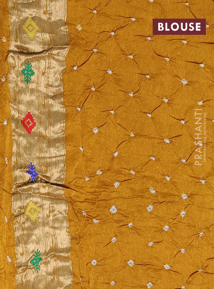 Dola silk saree mustard yellow with allover bandhani prints and paithani border