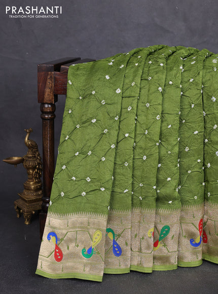 Dola silk saree light green with allover bandhani prints and paithani border